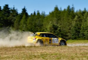 yellow and red race car on track during daytime